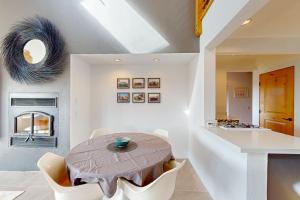 a kitchen and dining room with a table and chairs at Blue Mermaid in Sea Ranch