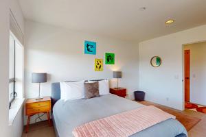 a bedroom with a large bed and two lamps at Blue Mermaid in Sea Ranch