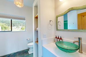 a bathroom with a sink and a mirror at Blue Mermaid in Sea Ranch