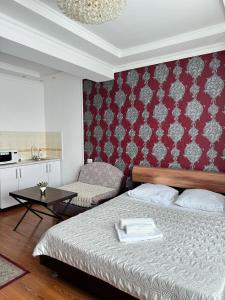Ένα ή περισσότερα κρεβάτια σε δωμάτιο στο Sky House Astana