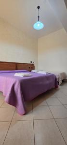 Postel nebo postele na pokoji v ubytování Hotel Ristorante La Decanata