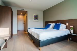 Voodi või voodid majutusasutuse Hotel Falko toas