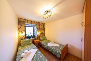 Ένα ή περισσότερα κρεβάτια σε δωμάτιο στο Village Villa Dobrski Dvori