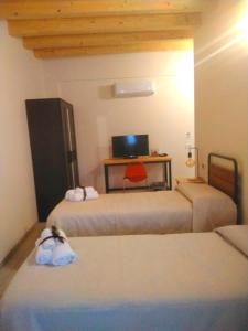 Postel nebo postele na pokoji v ubytování Coliving Giulia