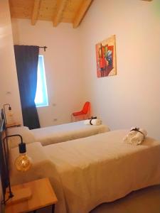 Postel nebo postele na pokoji v ubytování Coliving Giulia