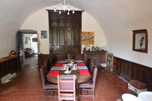 a dining room with a table and chairs at Chateau de Montcuquet in Lautrec