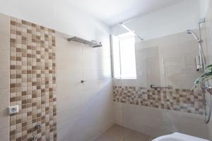 a bathroom with a shower and a toilet at Montana Studios in Braşov +17 photos