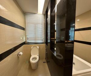a bathroom with a toilet and a sink at Large Family Villa Beach & Night Market Steps Away 20 Pax in Batu Ferringhi +41 photos
