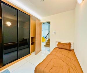 a bedroom with a bed and a large window at Large Family Villa Beach & Night Market Steps Away 20 Pax in Batu Ferringhi