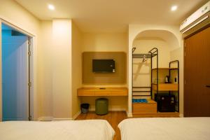 Postel nebo postele na pokoji v ubytování Ngọc Minh Châu Hotel