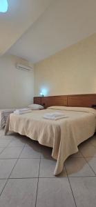 Postel nebo postele na pokoji v ubytování Hotel Ristorante La Decanata
