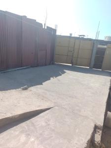 an empty parking lot next to a fence at Casa Amoblada de Verano Inclán Mollendo Arequipa in Mollendo