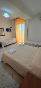 Postel nebo postele na pokoji v ubytování Hotel Ristorante La Decanata
