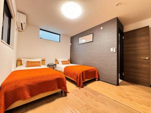 Letto o letti in una camera di Home Stroy in Tokyo - Luxury Villa Minowa&Ueno-三ノ輪一戸建て&東京屋語