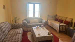 Predel za sedenje v nastanitvi Onar Mani Suites