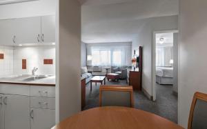 A cozinha ou cozinha compacta de L'Appartement Hôtel