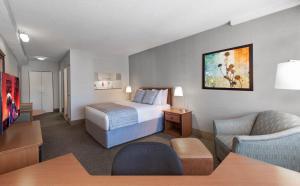 Cama ou camas em um quarto em L'Appartement Hôtel