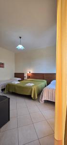 Postel nebo postele na pokoji v ubytování Hotel Ristorante La Decanata