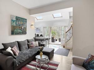 a living room with a couch and a table at The Cottage at Woodlands in Lynton