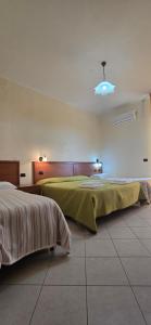 Postel nebo postele na pokoji v ubytování Hotel Ristorante La Decanata