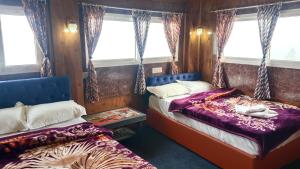 Postel nebo postele na pokoji v ubytování Mountain view homestay Darjeeling