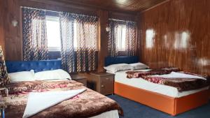 Postel nebo postele na pokoji v ubytování Mountain view homestay Darjeeling