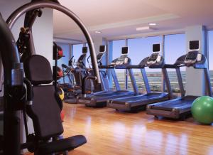 a gym with a row of treadmills at One Ocean Resort and Spa in Atlantic Beach