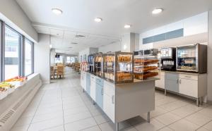 A cozinha ou cozinha compacta de L'Appartement Hôtel