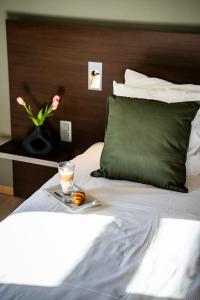 Voodi või voodid majutusasutuse Hotel Falko toas