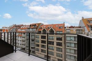 a view from the balcony of a building at Huswell - Home feeling apartment on top location in Knokke in Knokke-Heist