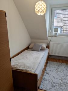 Postel nebo postele na pokoji v ubytování Moderne 70qm OG Wohnung nahe Würzburg, DAA, A3, A7, A81 in Fuchsstadt