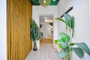 a hallway with potted plants in a house at Villa Verde Miami in Miami