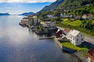 an aerial view of a small town on the water at Sjøhuset Sjøholt in Sjøholt
