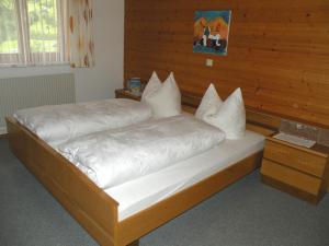 Letto o letti in una camera di Haus Simma