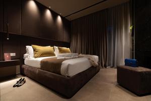 Postel nebo postele na pokoji v ubytování Donna Filomena Luxury Suites