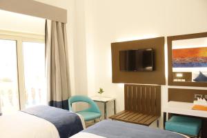 Postel nebo postele na pokoji v ubytování Gloria Aqua Park Hotel