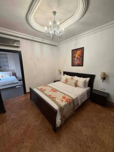 Postel nebo postele na pokoji v ubytování L'Appartement By PalmiResort