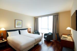 Cama o camas de una habitación en Sercotel Cornellà Barcelona