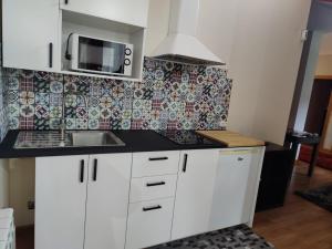 Kuchyň nebo kuchyňský kout v ubytování CASA PEDRASRUBIAS
