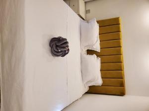 a room with two pillows on a bed at luxury marsa beach 2 in La Marsa