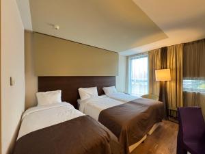 Ein Bett oder Betten in einem Zimmer der Unterkunft Hotel Artemis Amsterdam