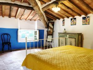 a bedroom with a bed in a room with blue walls at Villa Bianca charming Tuscany house with pool in Lucca