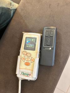 a nintendo wii game controller sitting on a couch at Sobrado, 4 Quartos, Piscina, até 12 pessoas in Foz do Iguaçu