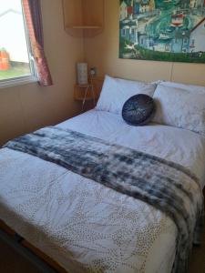 Ένα ή περισσότερα κρεβάτια σε δωμάτιο στο L90 HOLIDAY HOMe