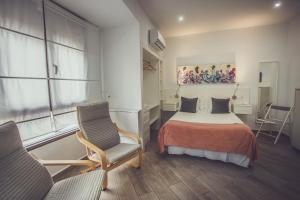 Posteľ alebo postele v izbe v ubytovaní Habitaciones El Olivo, Calidad y Reformardo
