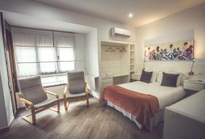 Posteľ alebo postele v izbe v ubytovaní Habitaciones El Olivo, Calidad y Reformardo