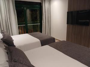 TV a/nebo společenská místnost v ubytování Hotel Santino