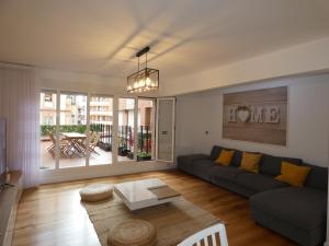 a living room with a couch and a table at GRAN BILBAO I in Barakaldo