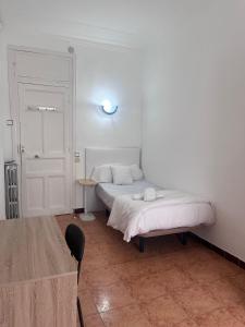 Postel nebo postele na pokoji v ubytování Hostal Alonso No Limit Madrid