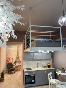 a kitchen with a bunk bed in a room at Paris - Szeged City Center in Szeged